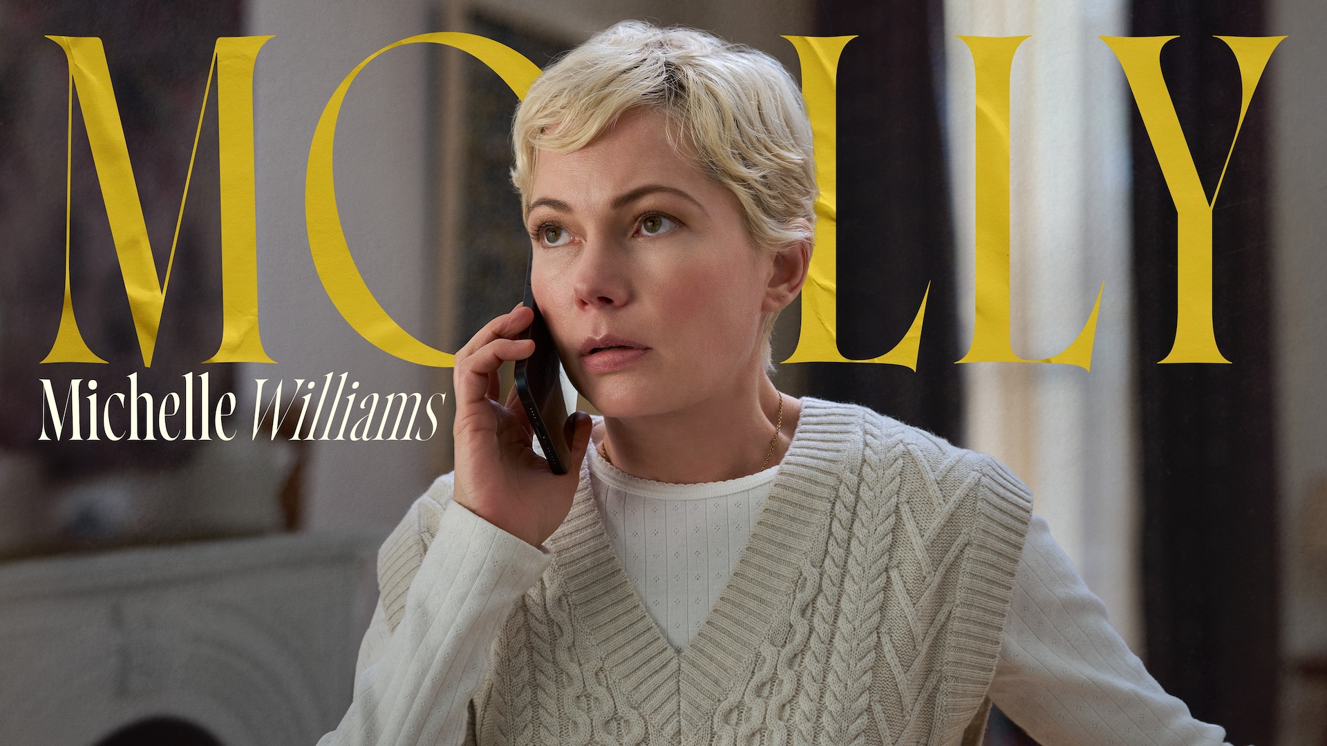 Michelle Williams as Molly Kochan in FX's Dying For Sex, wearing an ivory vest cardigan, while on the phone.