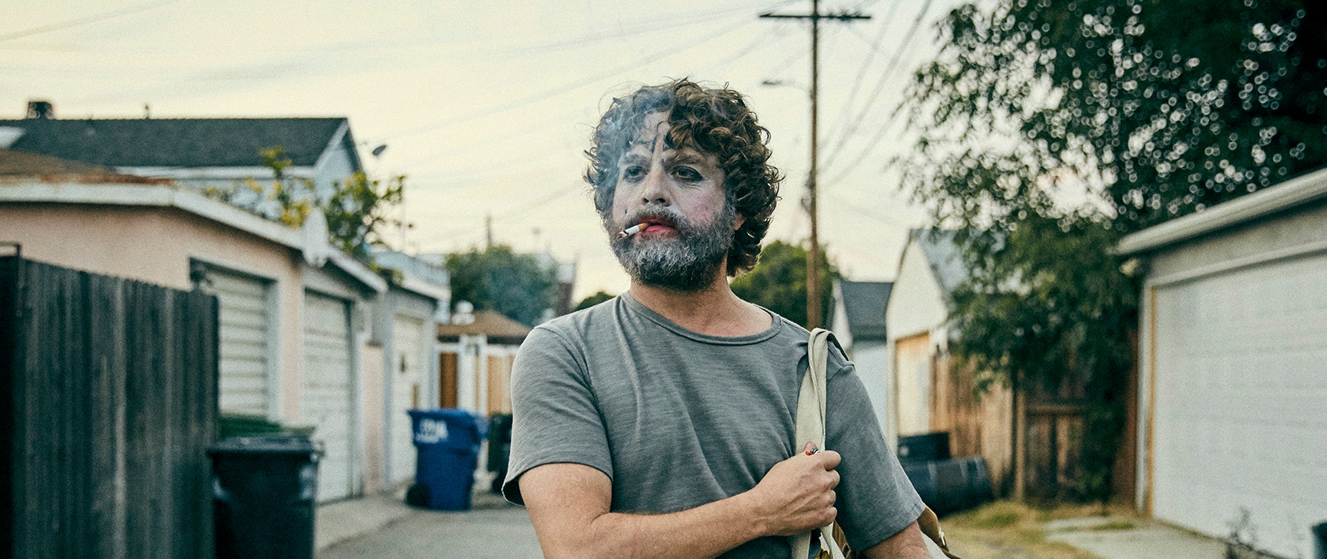 Zach Galafianakis as Chip Baskets for FX's Baskets in clown makeup walking through the streets.