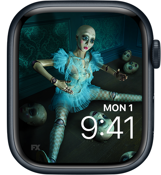 Apple Watch lock screen of doll sitting with doll heads and wearing blue dress FX's American Horror Stories