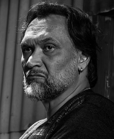 Jimmy Smits headshot with a serious facial expression in black and white effect