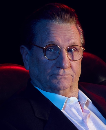 Ed O'Neill as Donald Sterling in FX's Clipped Wearing a suit with a white button up shirt.