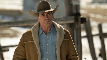 Roy Tillman wearing cowboy hat and denim shirt standing outside. 