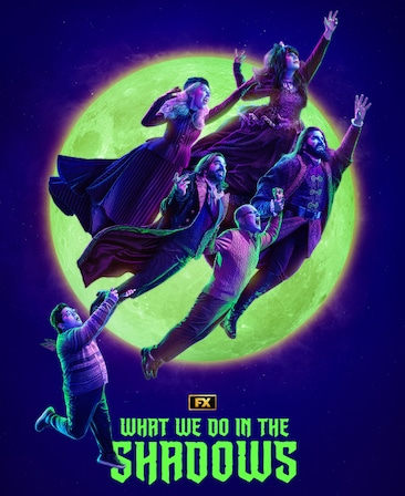 Vampire cast of What We Do in the Shadows flying in the night sky with lime green full moon behind them.