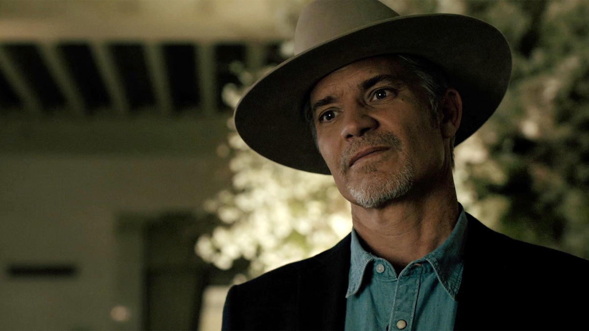 Raylan Givens wearing a cowboy hat, denim shirt and suit jacket