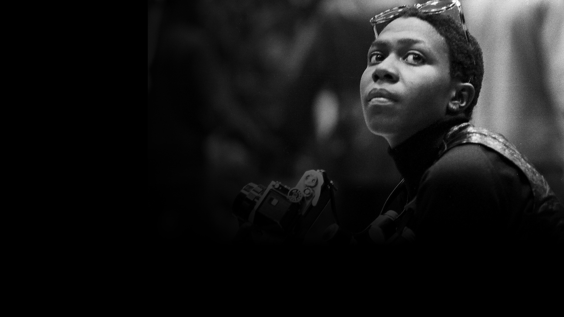 background image of black woman with a camera