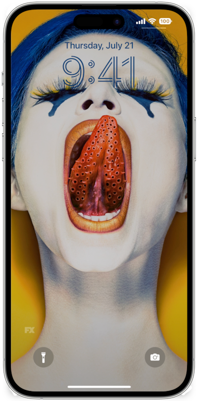 iPhone lock screen of woman with blue hair and eyeshadow closing eyes and licking lips with holed tongue from FX's AHS Cult