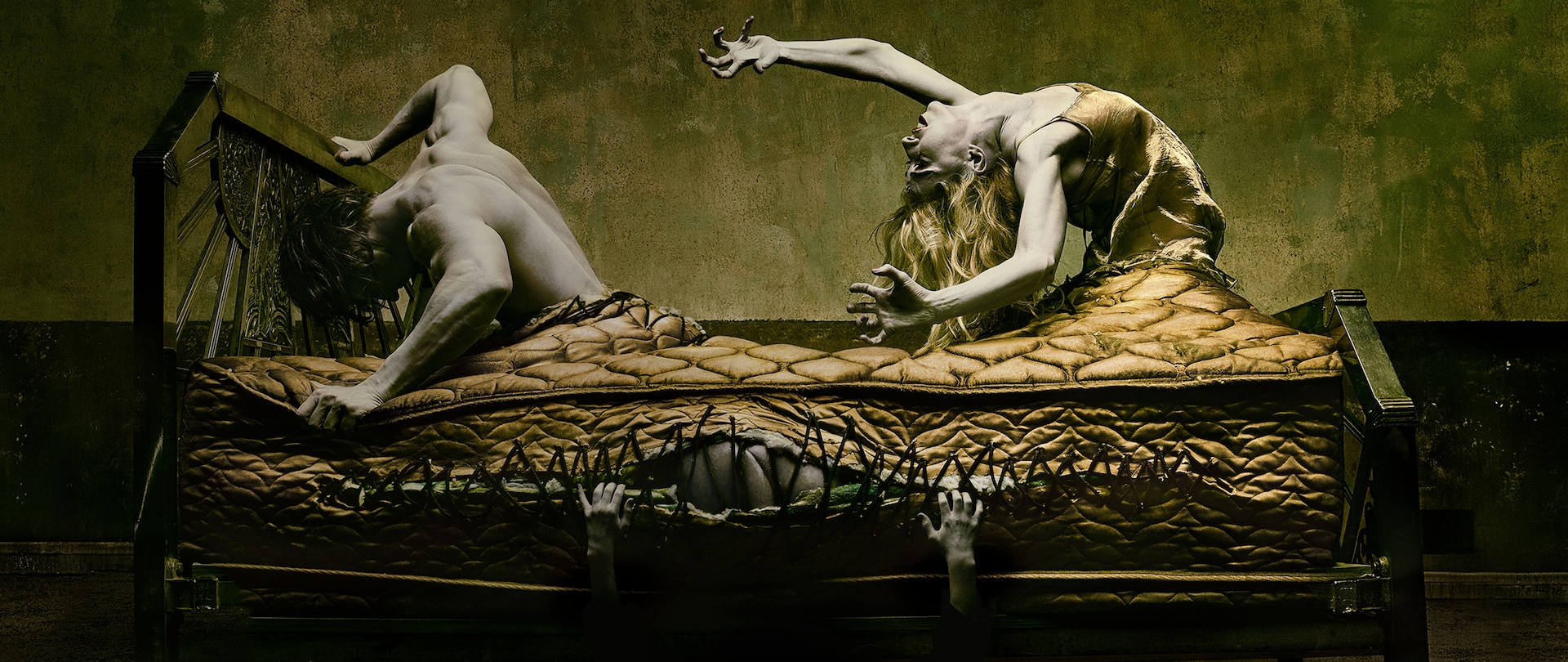 People climbing out of gold mattress and breaking bed frame American Horror Story Installment 5 Hotel