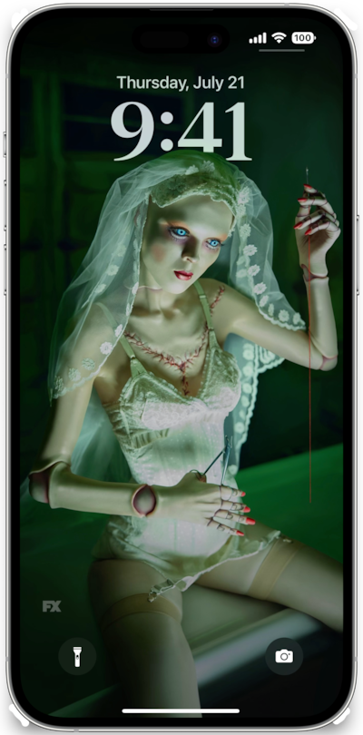 iPhone lock screen of doll wearing white undergarments wearing veil and holding needle from FX's American Horror Stories