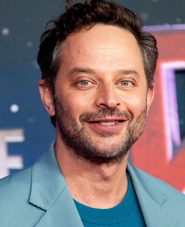 Headshot of executive producer Nick Kroll, wearing a blue sweater and baby blue blazer. 