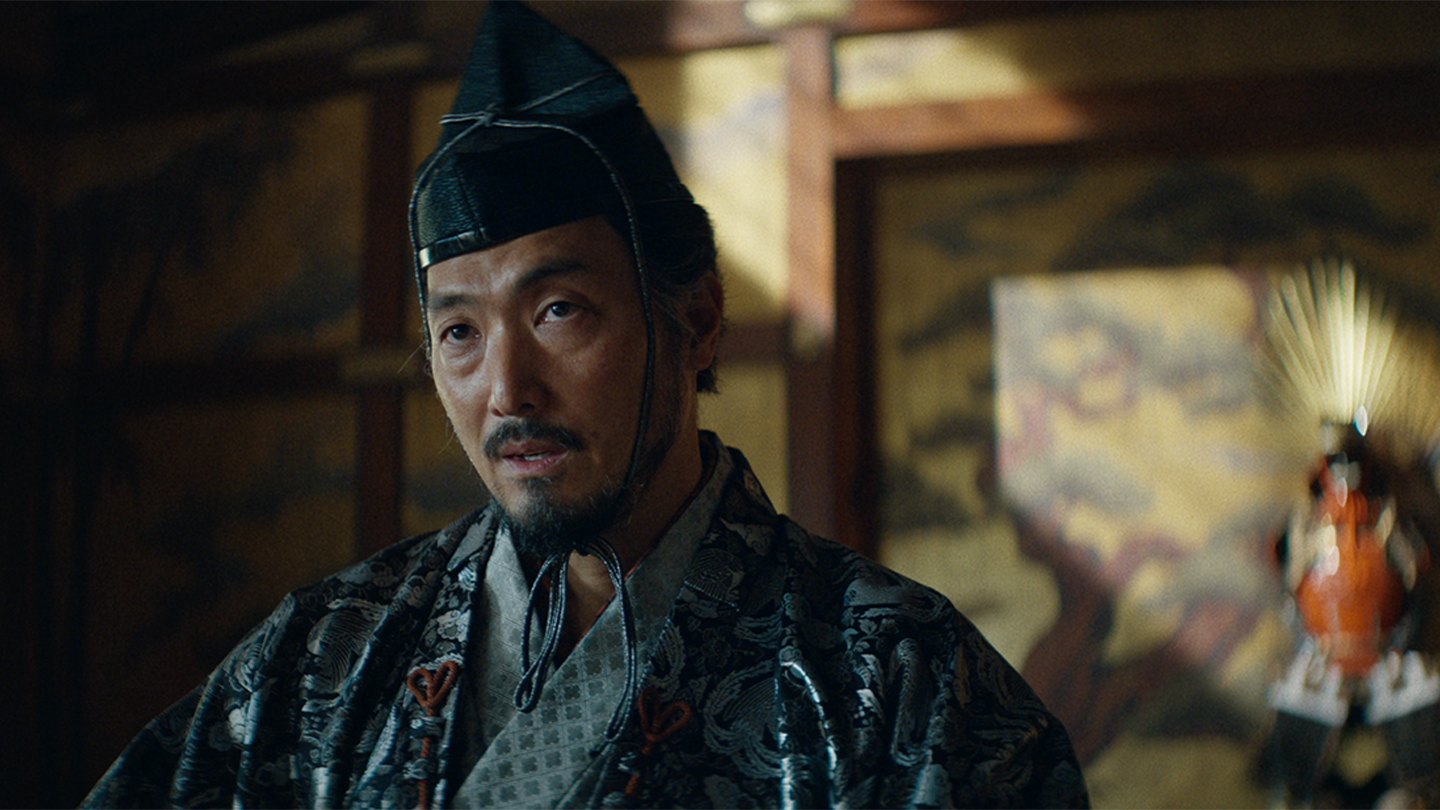 Close up of Ishido with Taiko's armor on display in the background