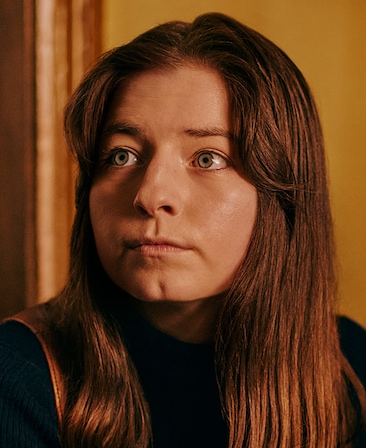 Hazel Doupe as Marian Price in FX's Say Nothing in a black long sleeve.