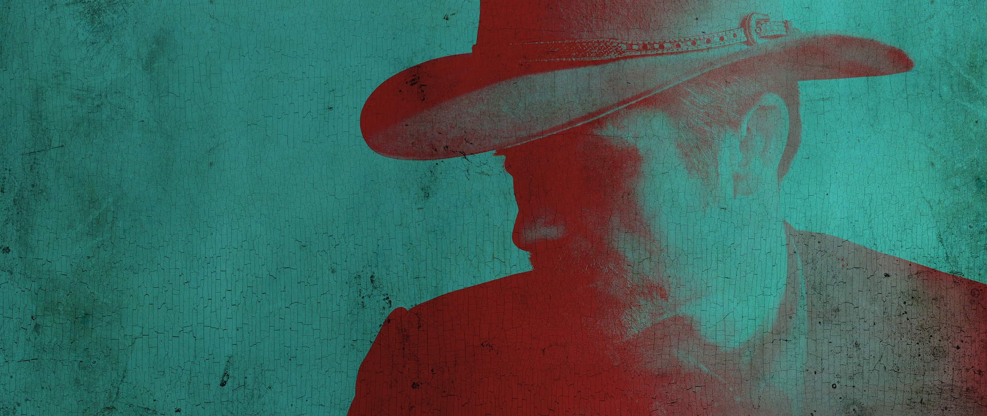 Close up of Marshal Raylan Givens wearing a cowboy hat in hues of teal, red and black for FX's Justified