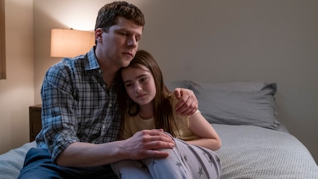 Jesse Eisenberg as Toby Fleishman hugging Meara Mahoney Gross as Hannah crying on bed in FX's Fleishman Is In Trouble