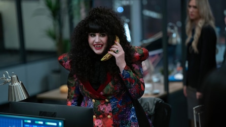Nadja holding a banana up to her ear like a phone.