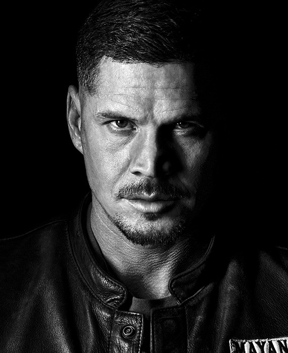 JD Pardo headshot wearing a black leather Mayans Jacket