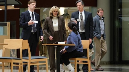 Sarah Paulson as Linda Tripp with 2 FBI agents approaches Beanie Feldstein as Monica Lewinsky in ACS Impeachment