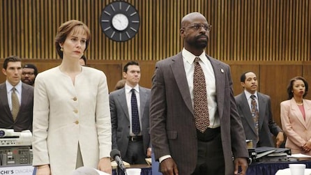 Sterling K Brown as Christopher Darden standing with Sarah Paulson as Marcia Clark in court room in ACS Installment 1