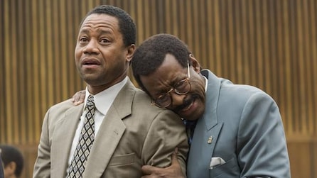 Courtney B Vance as Johnnie Cochran leaning onto shoulder of surprised Cuba Gooding Jr as OJ Simpson in ACS Installment 1