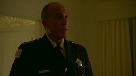 Police officer in white living room from American Crime Story Installment 2 Episode 3