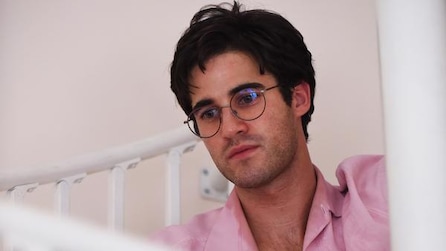 Darren Criss as Andrew Cunanan in pink button down and glasses in American Crime Story Installment 2 Episode 9