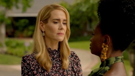 Sarah Paulson as Cordelia Foxx in black floral top looking at Adina Porter as Dinah Stevens in driveway in AHS Apocalypse