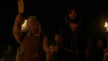Kathy Bates holding butcher knife next to Wes Bentley with beard with torches and mob behind them in AHS Roanoke
