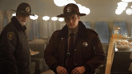 Patrick Wilson as Lou Solverson and Ted Danson as Sheriff Hank Larsson in police uniform inside diner in FX's Fargo Year Two