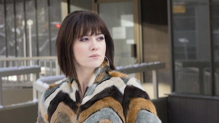 Mary Elizabeth Winstead as Nikki Swango in multicolor fur coat walking outside building with snow in FX's Fargo Year Three