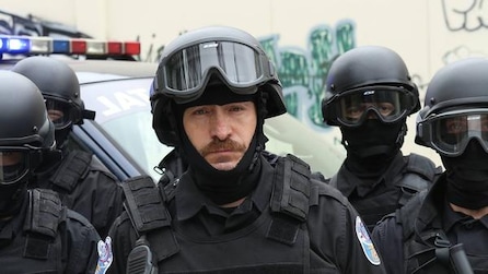 Ted Levine as Lt. Hank Wade in swat protective gear with goggles raised in FX's The Bridge