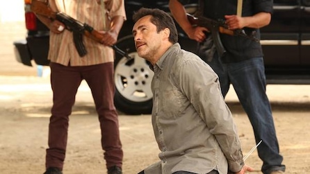 Demian Bichir as Marco ziptied on ground with men holding guns in background in FX's The Bridge