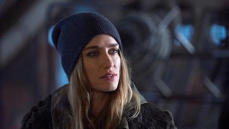 Woman with blonde hair in a black beanie