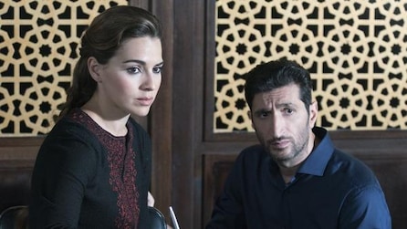 Woman and man with serious expressions on their face