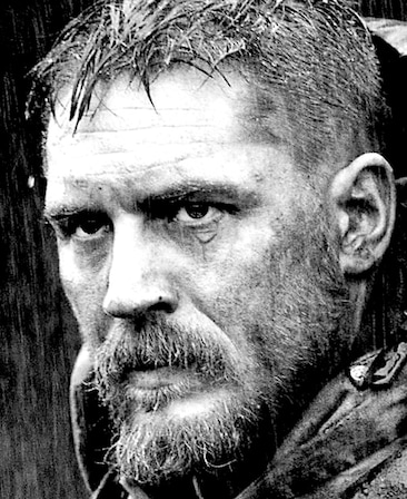 Tom Hardy Headshot with a serious expression in black and white filter 