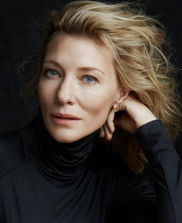 Cate Blanchett headshot wearing a black turtle neck and resting her head on her hand
