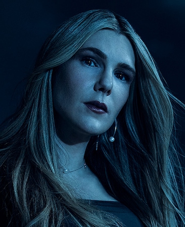 Headshot of Lily Rabe in moonlight with pearl jewelry and black shirt from FX's AHS Double Feature