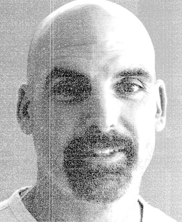 Tom Sellitti headshot wearing a white shirt