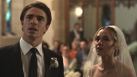 Groom and bride look up shocked with guests in background in American Horror Stories Installment 2