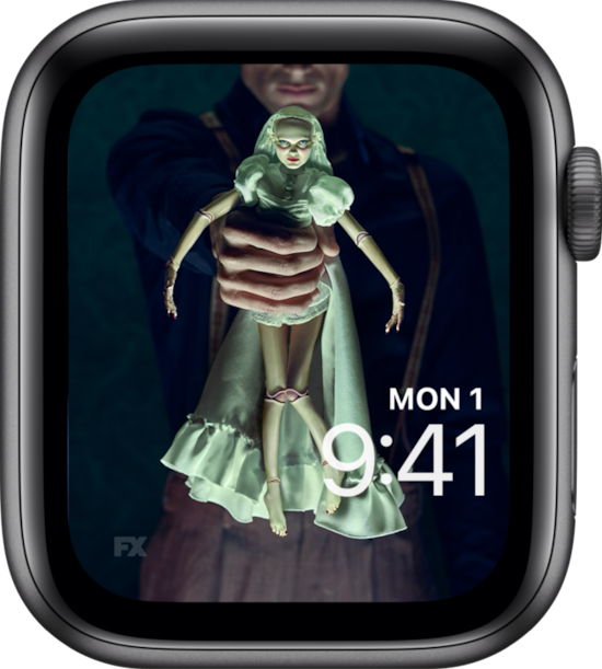 Apple Watch lock screen of man in uniform holding white bride doll from FX's American Horror Stories