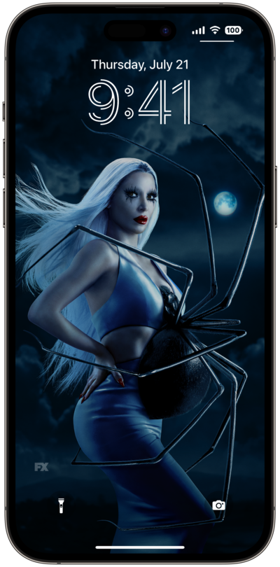 AHS: Delicate lock screen of a woman with white hair, standing with a spider on her stomach, in front of a dark and cloudy ba