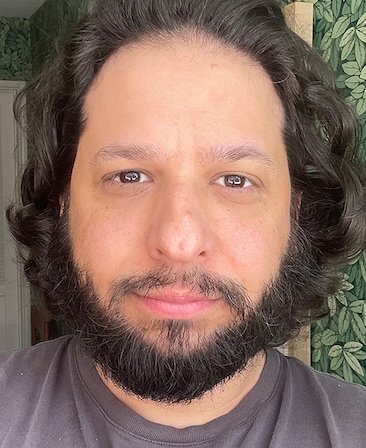 Headshot of executive producer Dave King, wearing a brown tshirt.