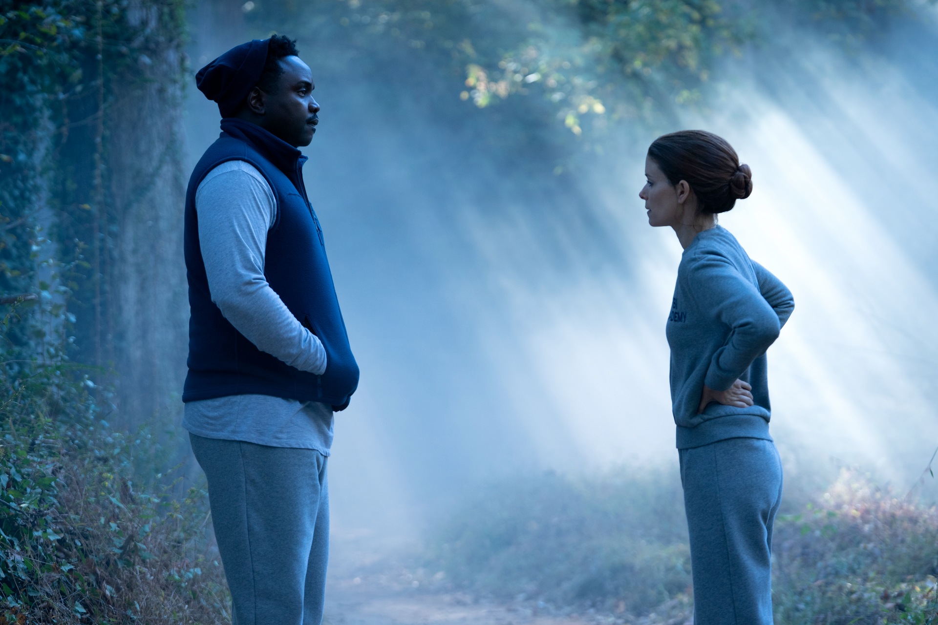 Brian Tyree Henry as Tayo Michaels and Kate Mara as Ashley Poet talking in the woods