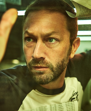 Ebon Moss-Bachrach headshot wearing a baseball tee