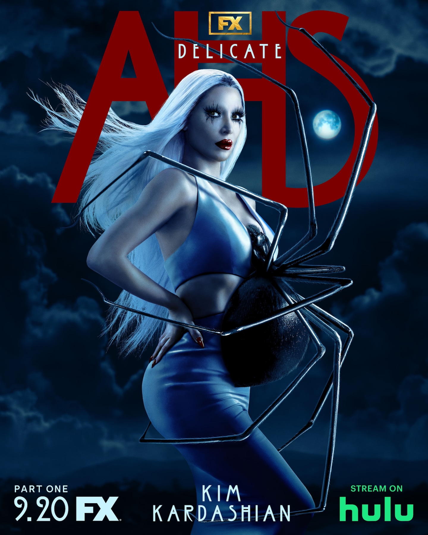 A woman with white hair standing with a spider on her stomach, in front of a dark and cloudy background for AHS: Delicate