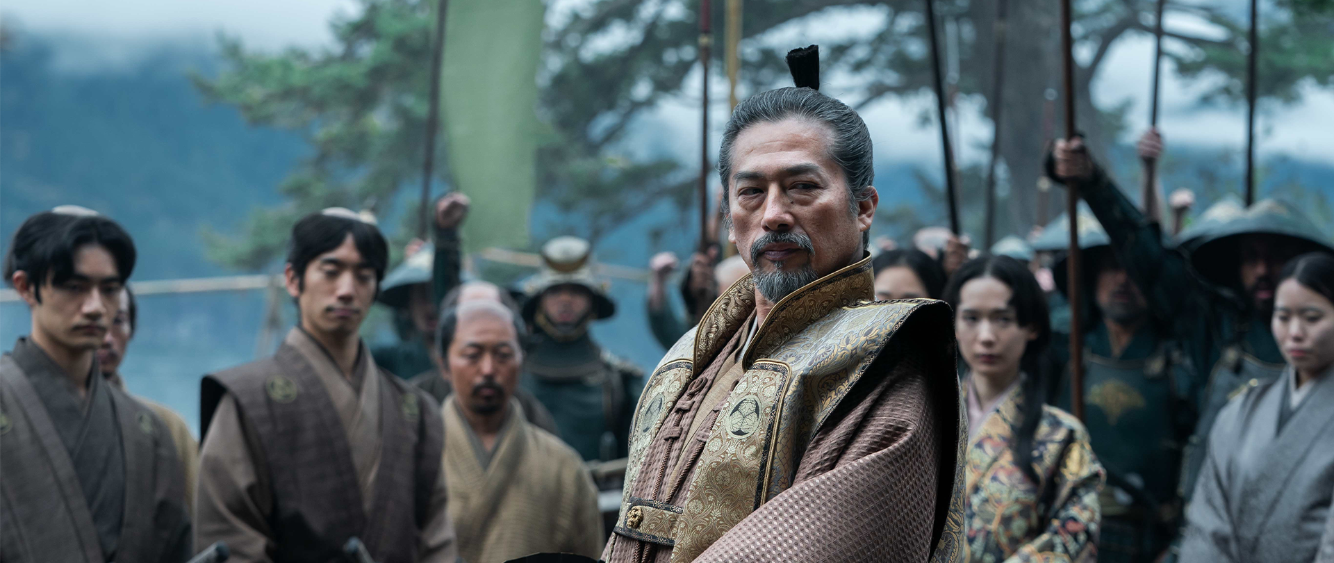 Toranaga stands in the center on the crowded shore