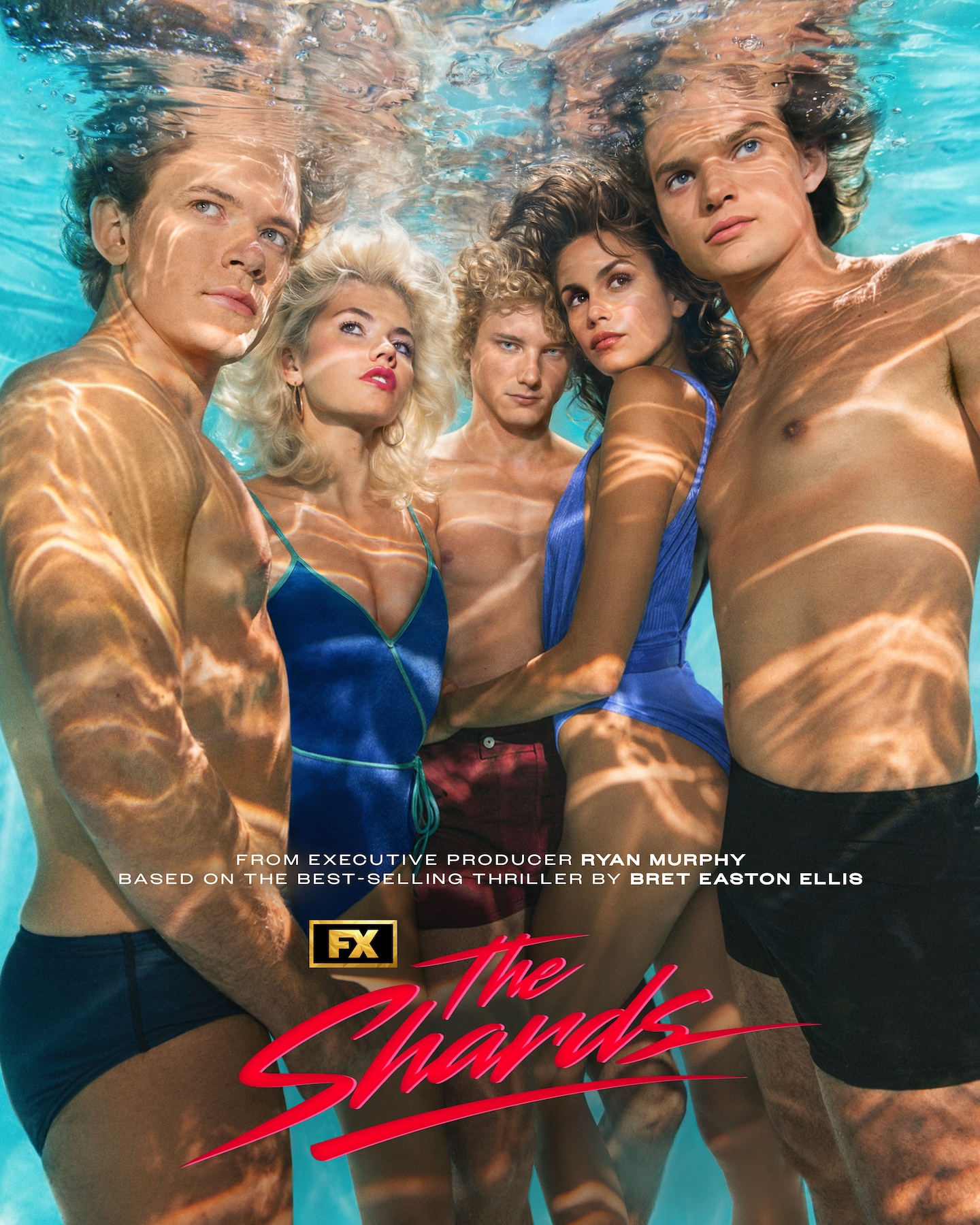 FX's The Shards full cast, underwater in a pool wearing blue, red and black swimsuits.