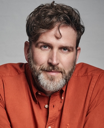 Humphrey Ker in an orange button up