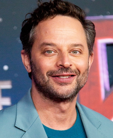 Headshot of executive producer Nick Kroll, wearing a blue sweater and baby blue blazer. 