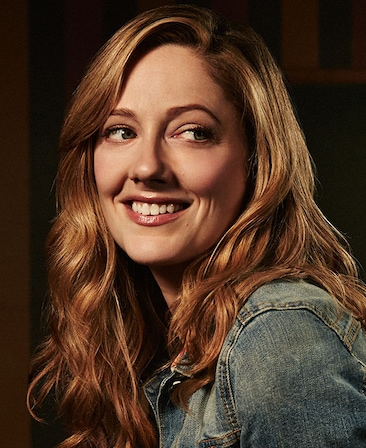 Judy Greer headshot wearing a denim jacket