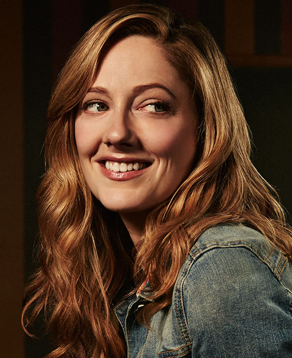 Judy Greer headshot wearing a denim jacket