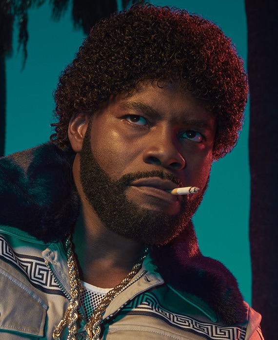 Amin Joseph headshot holding a cigarette in his mouth